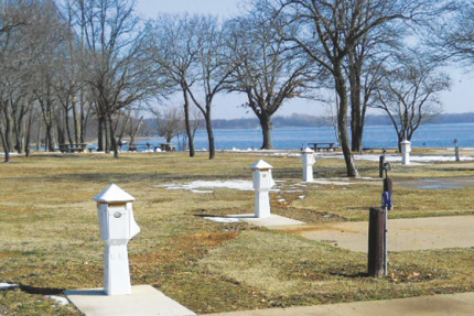 line of power port pedestals in RV park by lake